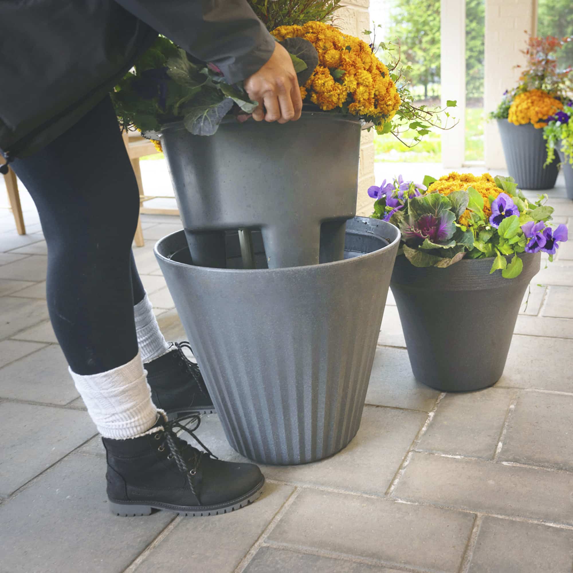 Person inserting the TruDrop insert into the fold planter