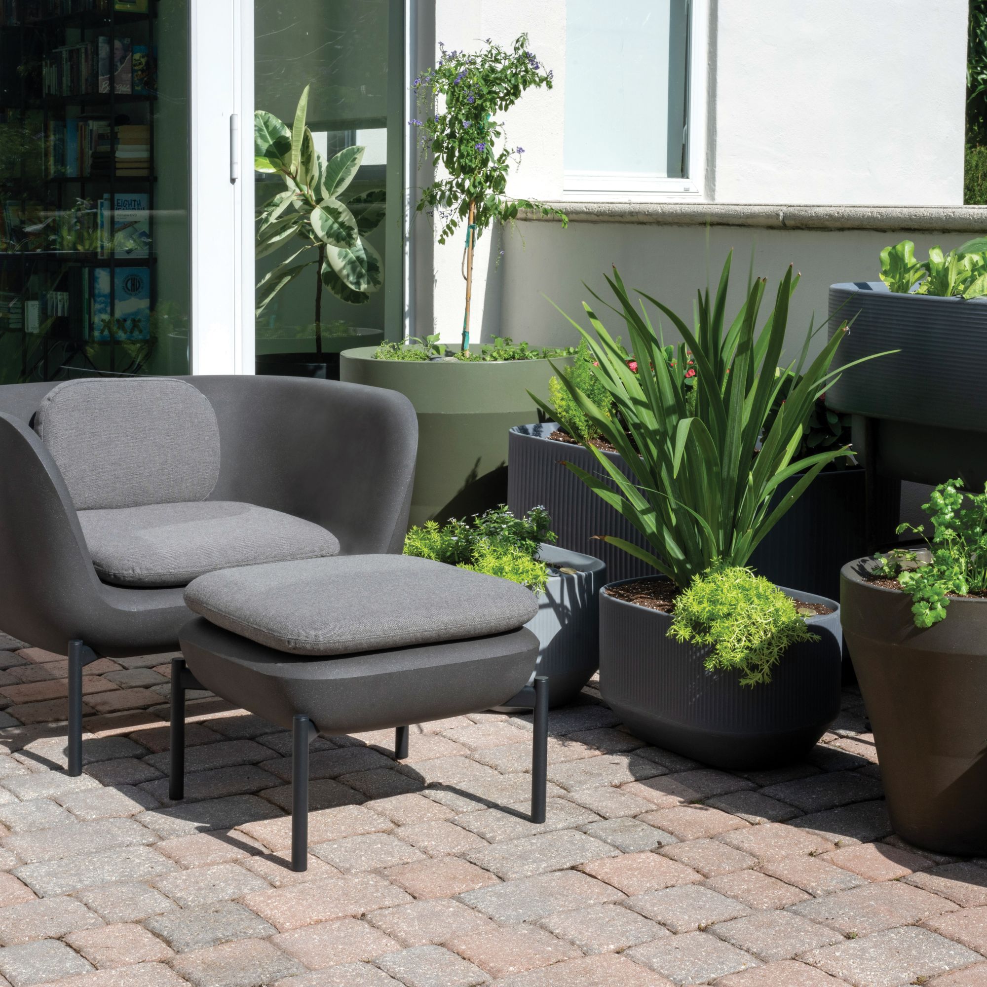 InOu Elements Outdoor Furniture with a variety of self-watering planters by Crescent Garden